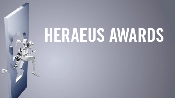 White lettering "Heraeus Awards" on a grey background