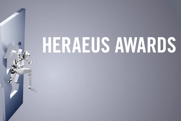 White lettering "Heraeus Awards" on a grey background