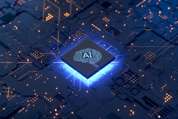 システムを動かす小さな脳と「AI」の文字がプリントされた、光るコンピューターチップ。 