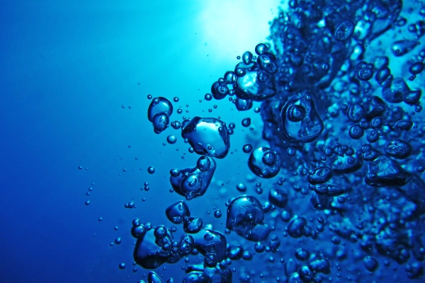 Bubbles in the water with light coming through