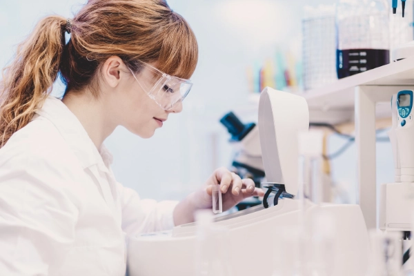 Woman looking through a spectroscopy