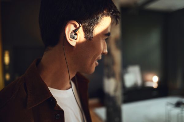 Side profile of a man wearing Sennheiser IE600 Headphones 